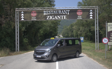 Vehicle with Restaurant Zigante backdrop in Porec - convenient transport to a renowned dining spot